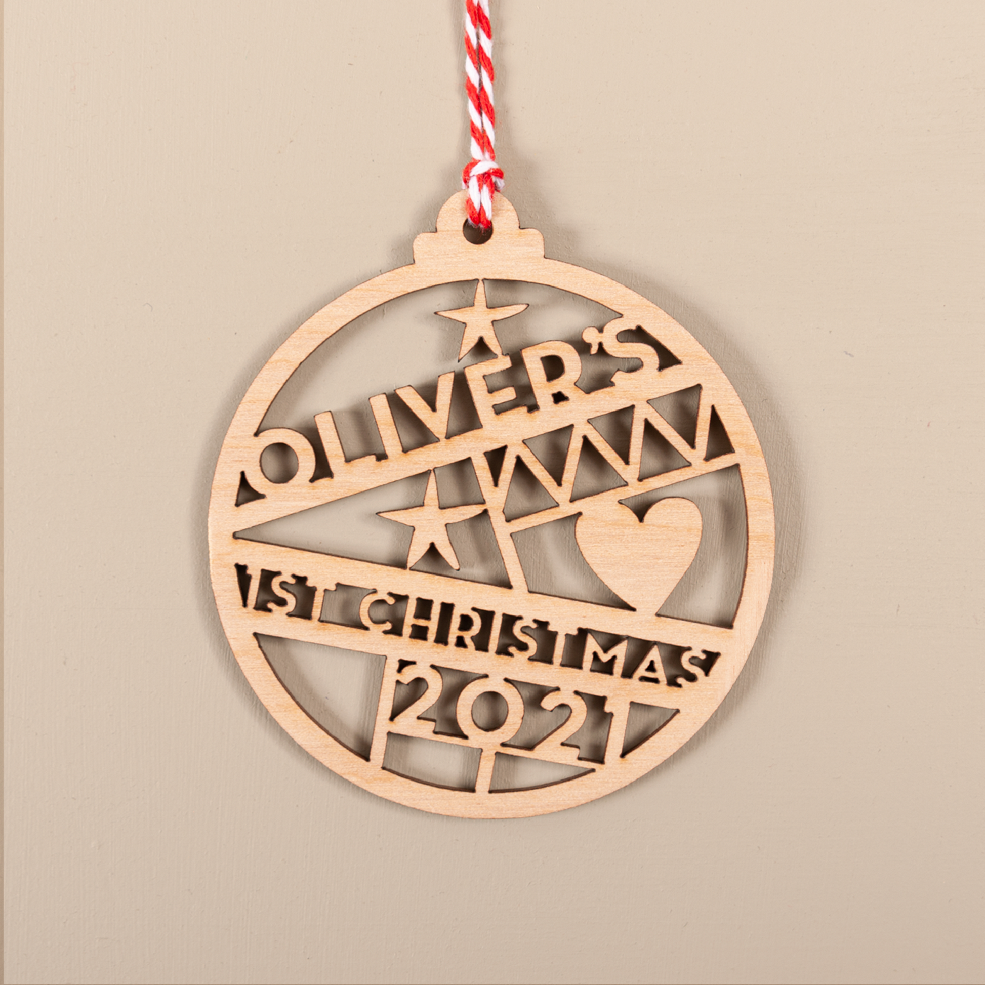 Personalised cut-out typography baby name bauble with year