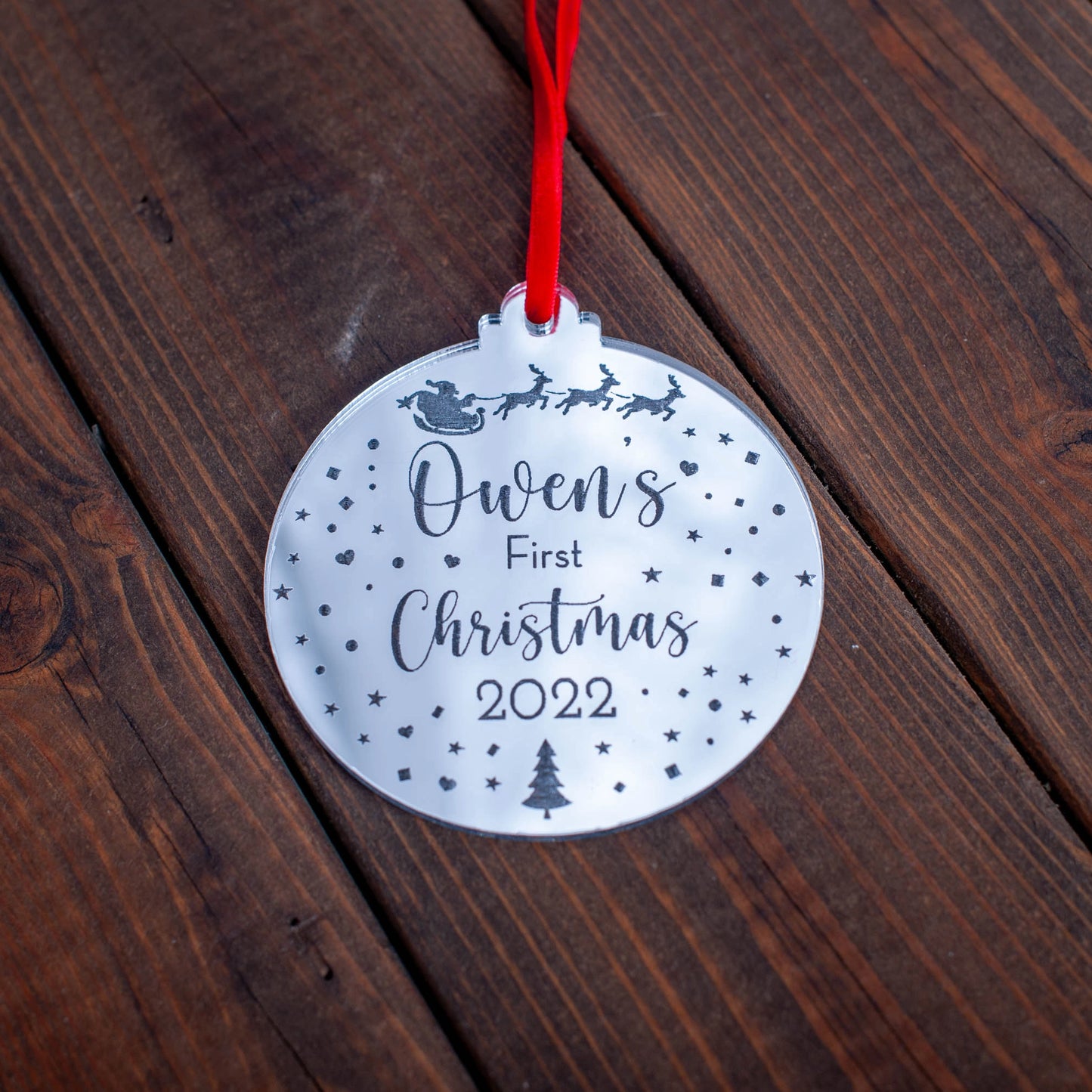 Silver mirror baby’s first Christmas bauble engraved with Santa and sleigh design
