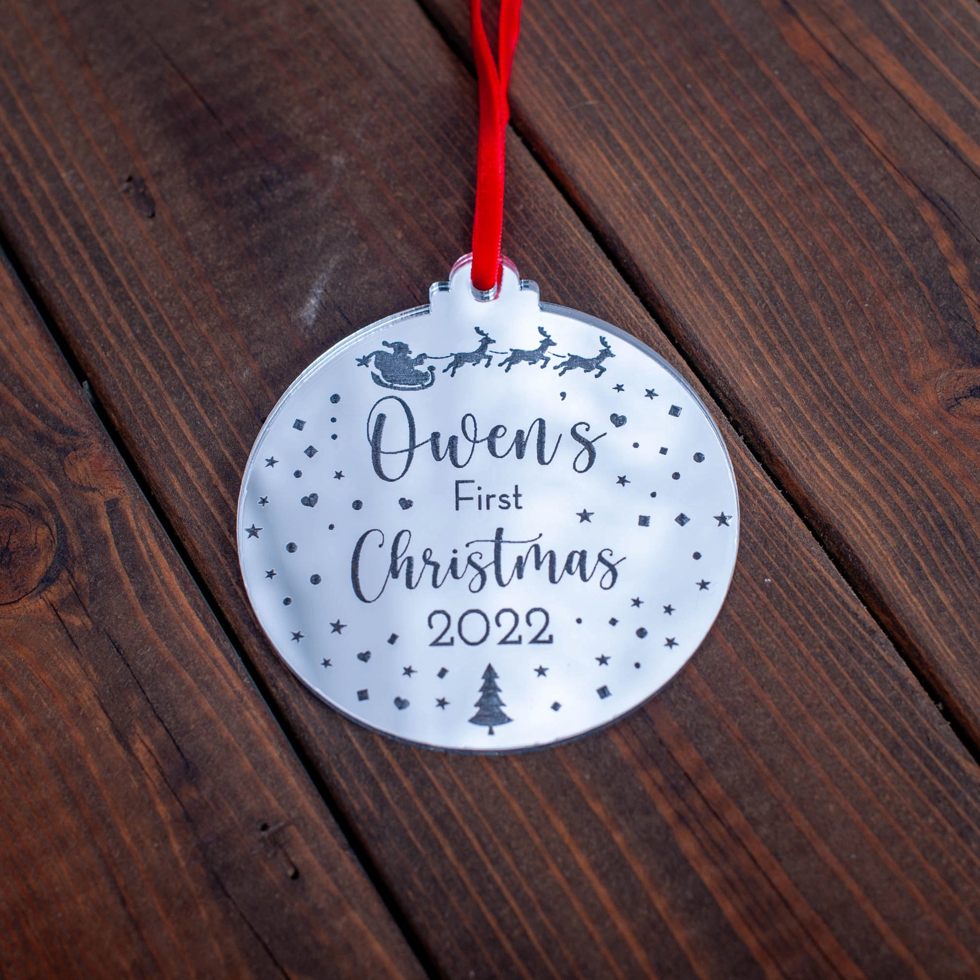Silver mirror baby’s first Christmas bauble engraved with Santa and sleigh design