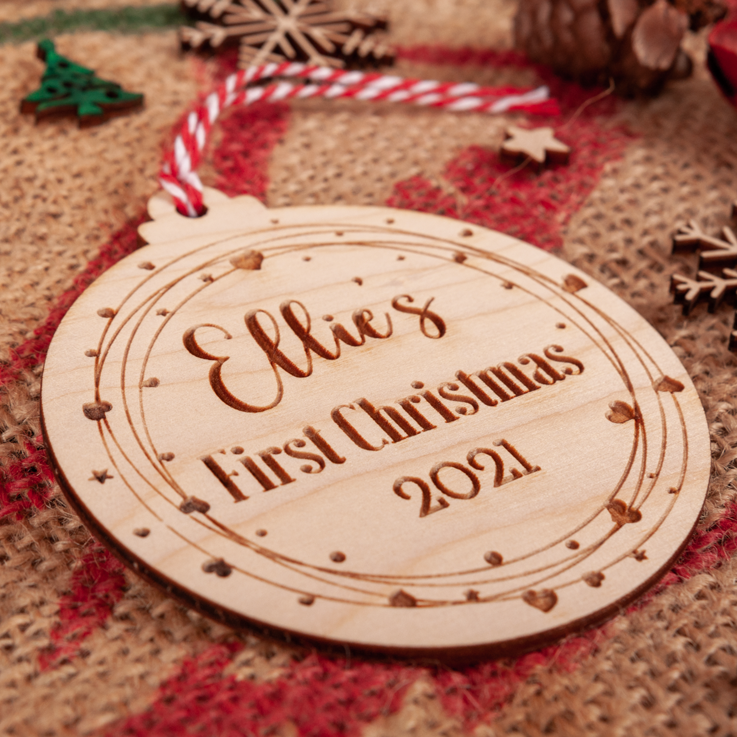 Wooden heart wreath baby’s first Christmas bauble engraved