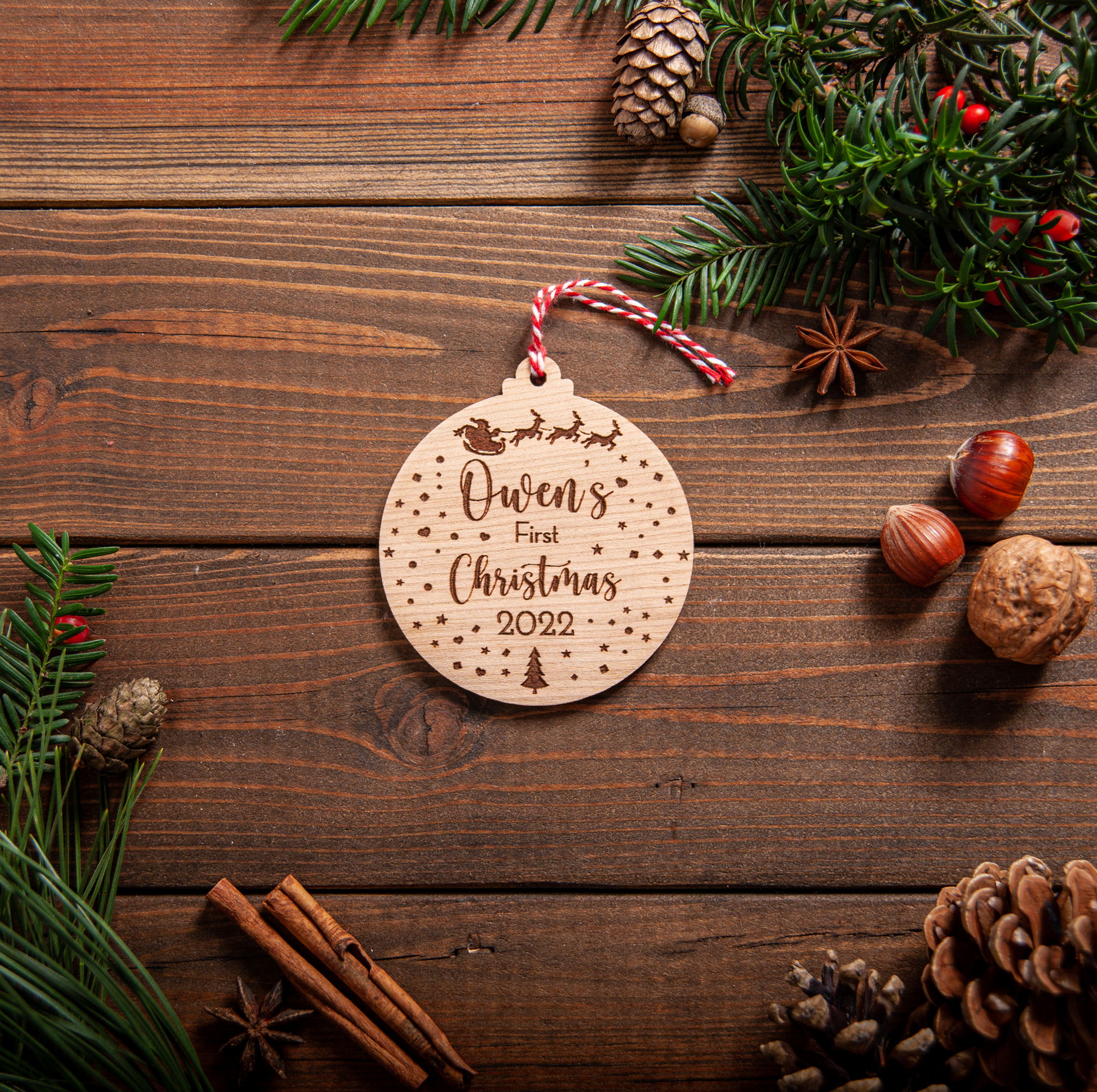 Personalised snow-globe baby’s first Christmas bauble with name and year