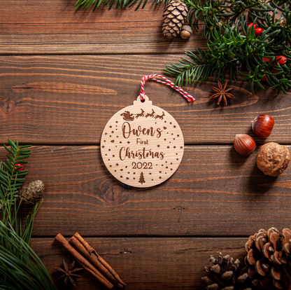 Personalised snow-globe baby’s first Christmas bauble with name and year