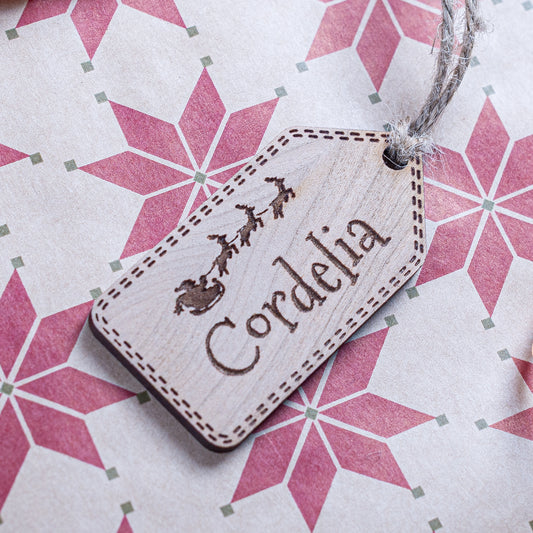 Personalised Christmas gift tag engraved with name and Santa detail