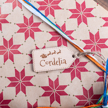 Laser cut wooden Christmas tag with sleigh and Santa engraving