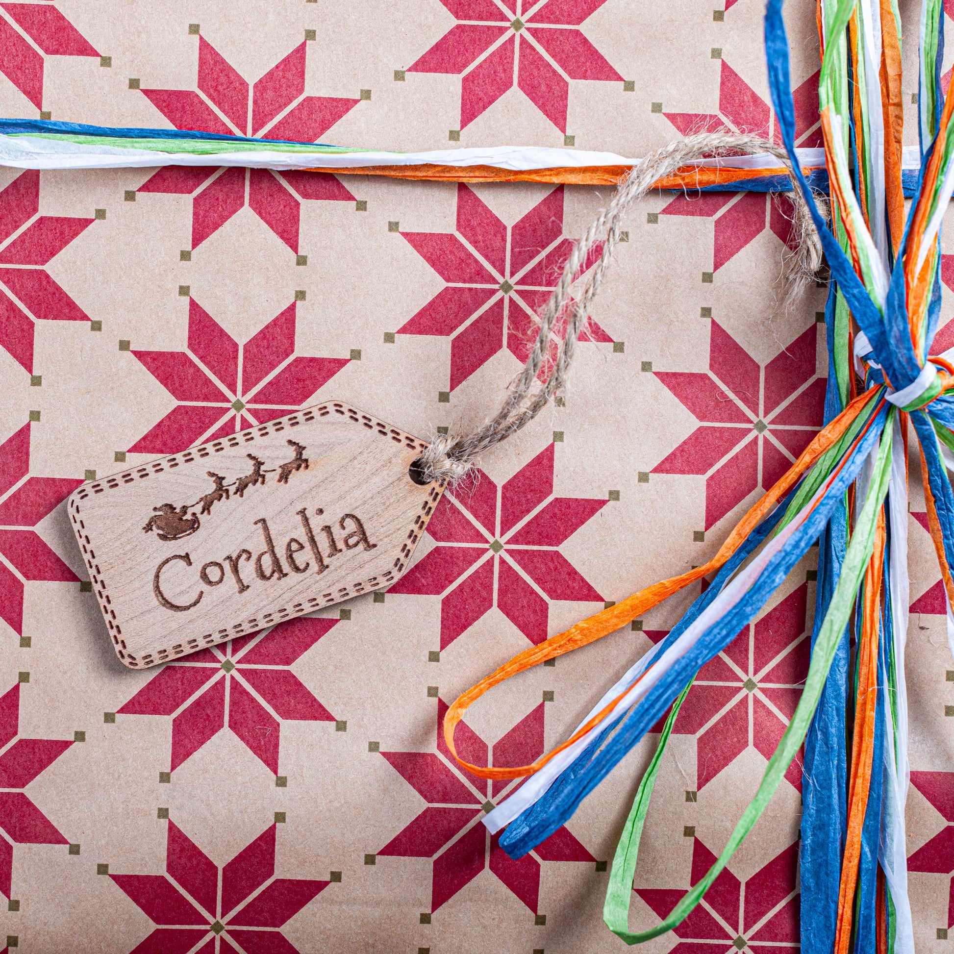 Personalised Santa and sleigh wooden ornament used as gift tag