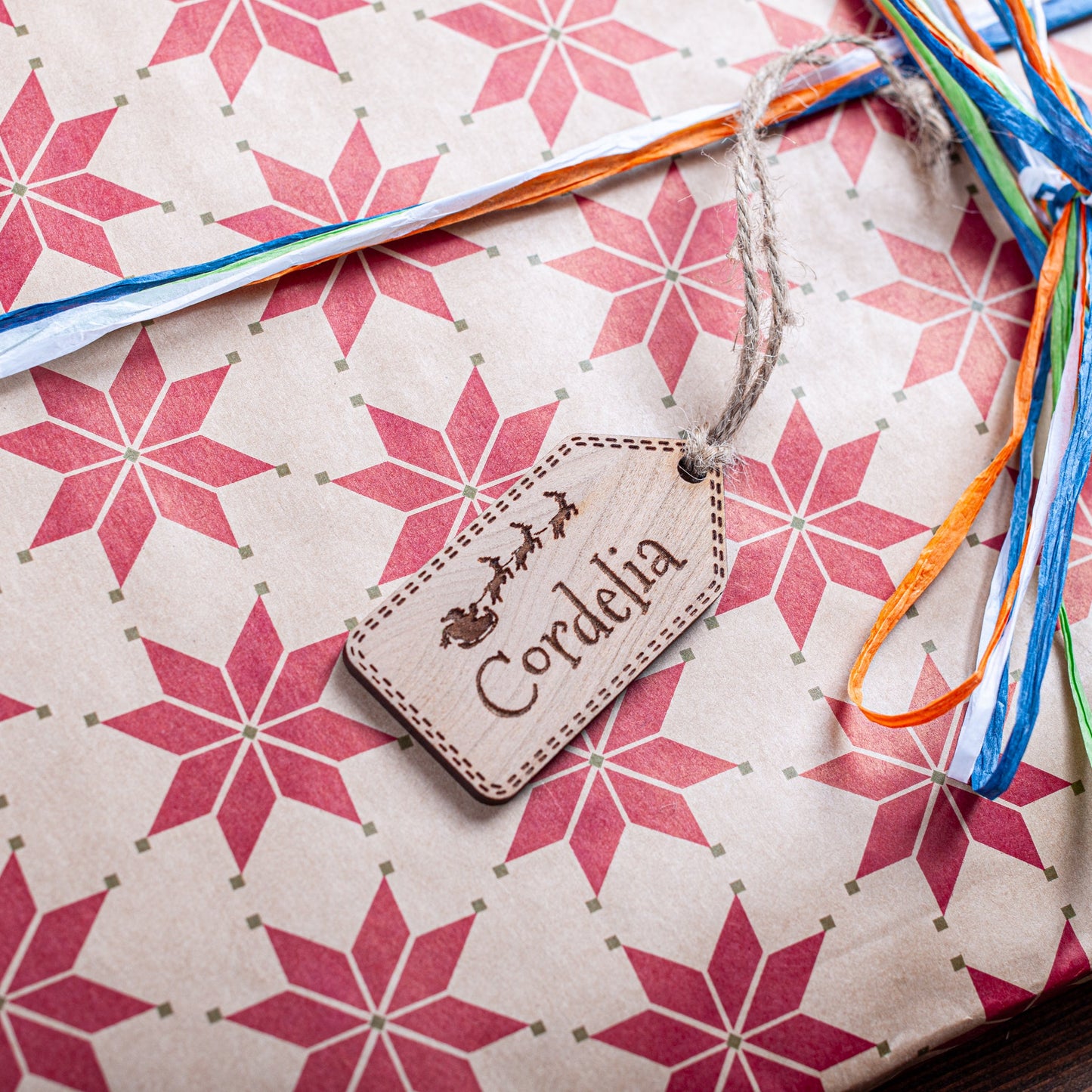 Rustic wooden gift tag engraved with Santa sleigh detail for Christmas presents