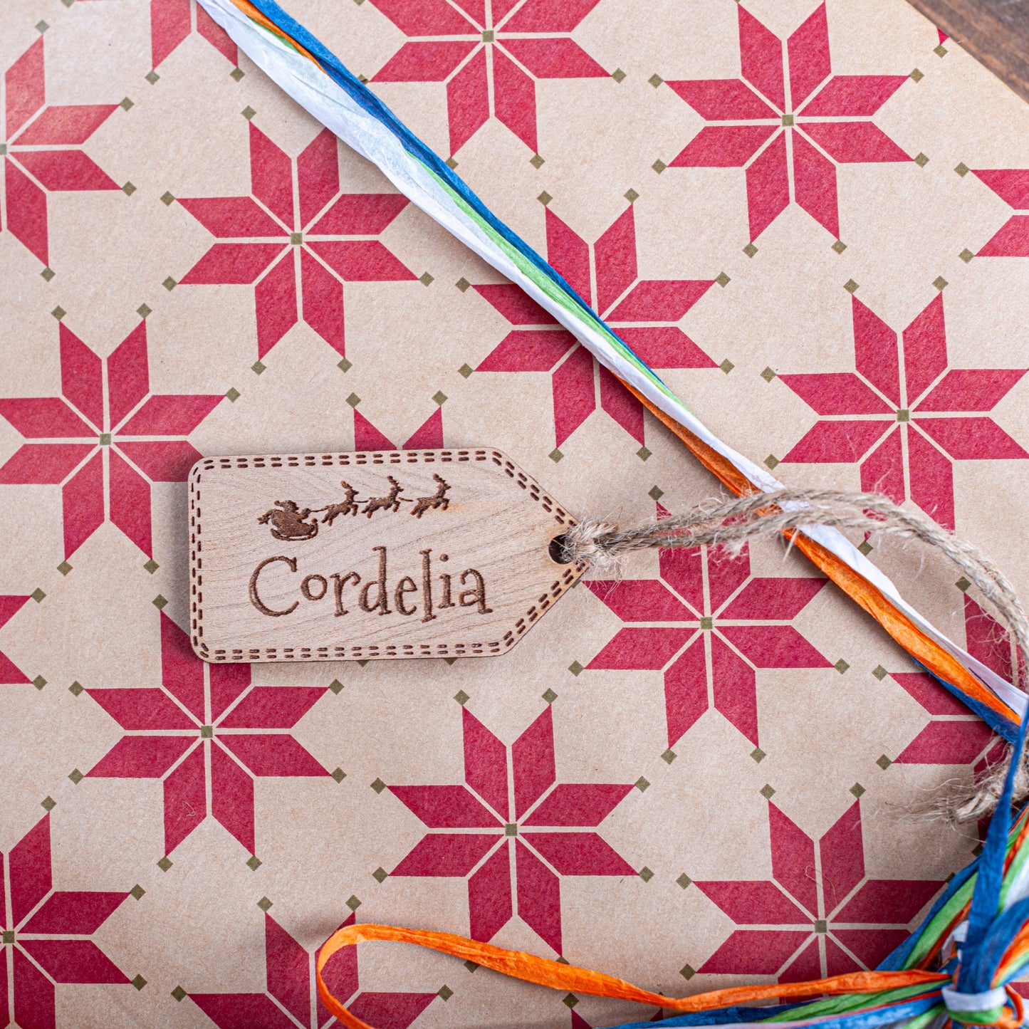 Custom name wooden Christmas tag with engraved Santa illustration for gift wrapping