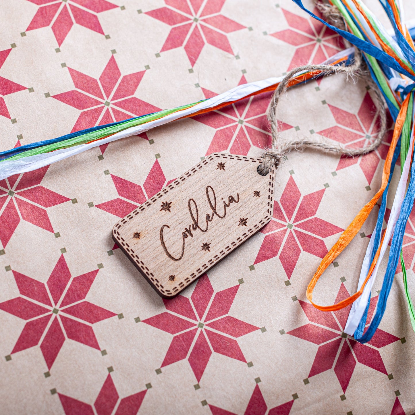 Eco-friendly engraved wood Christmas tag with stars for festive gifts