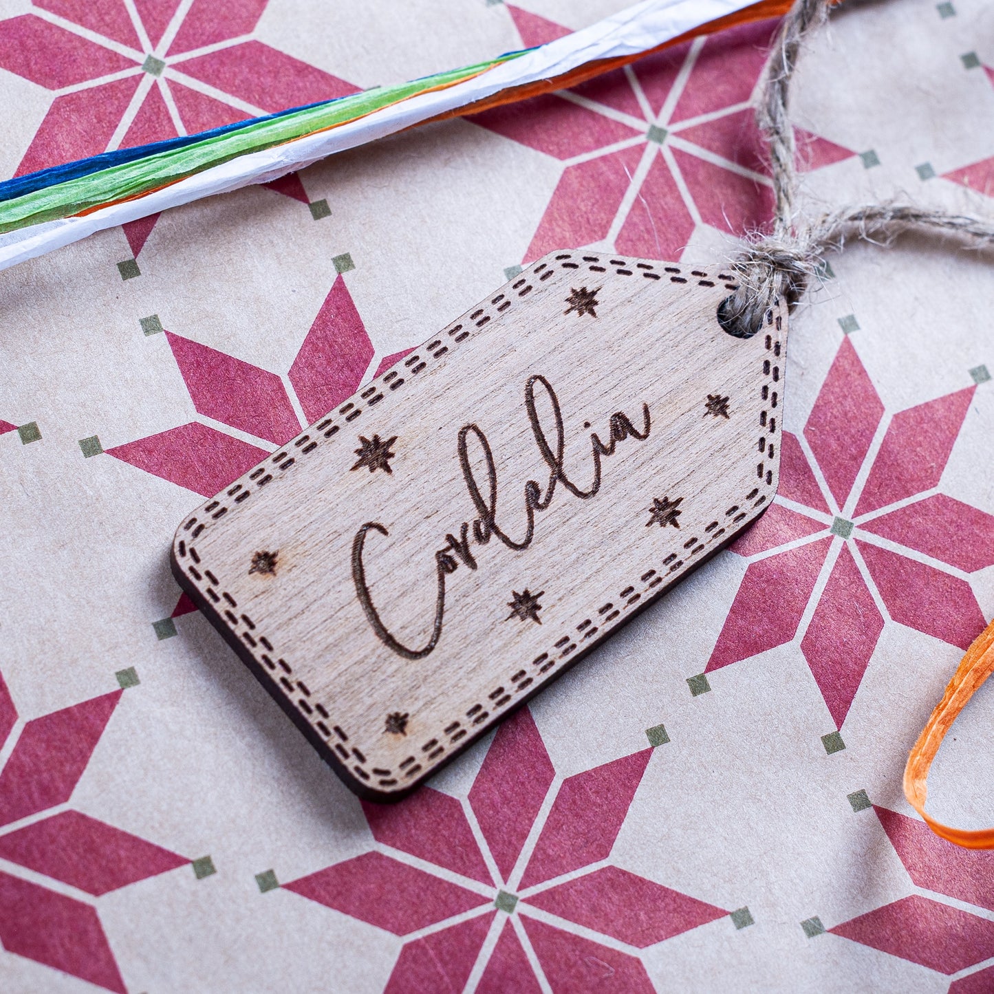 Personalised wooden Christmas gift tag engraved with star details