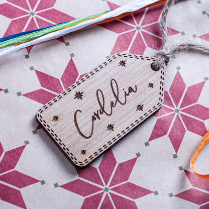 Personalised wooden Christmas gift tag engraved with star details