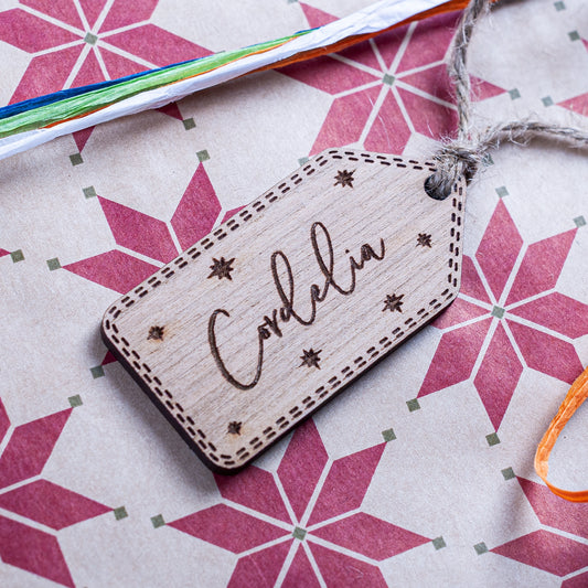 Personalised wooden Christmas gift tag engraved with star details