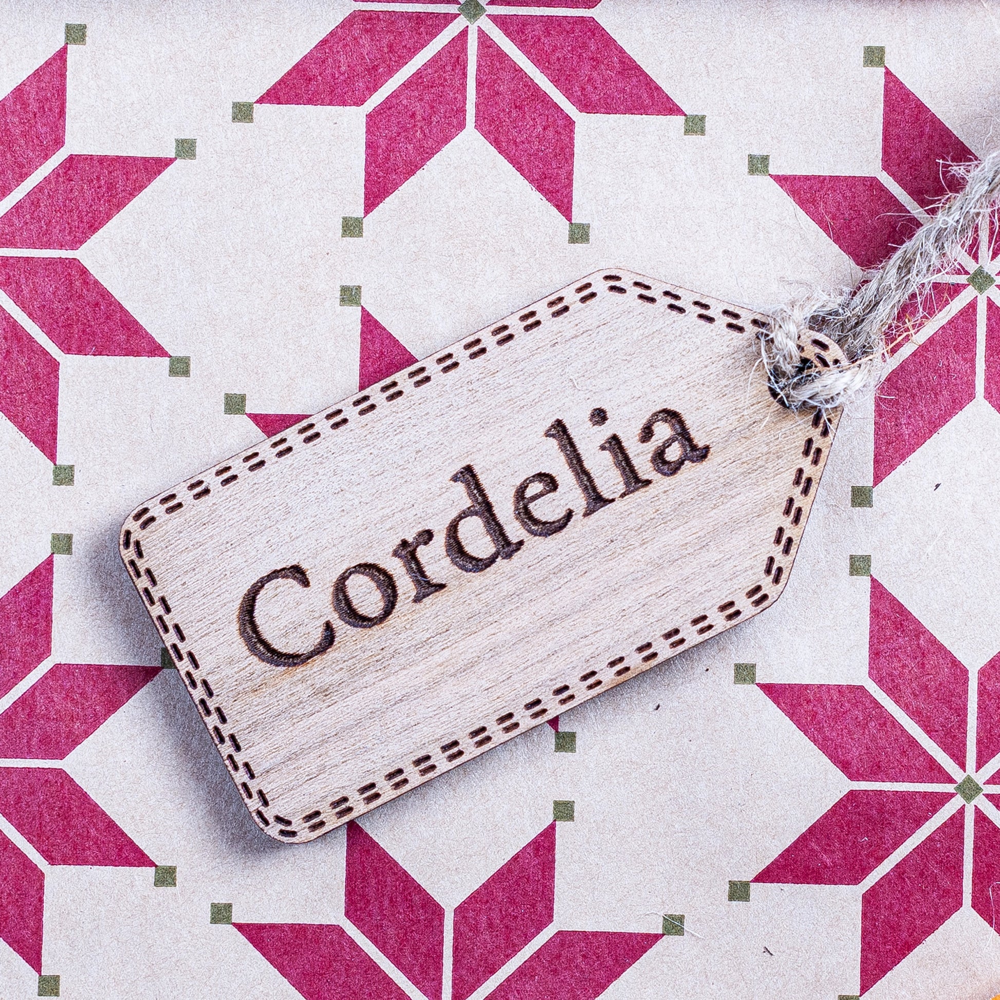 Personalised wooden Christmas gift tag with engraved name for festive wrapping