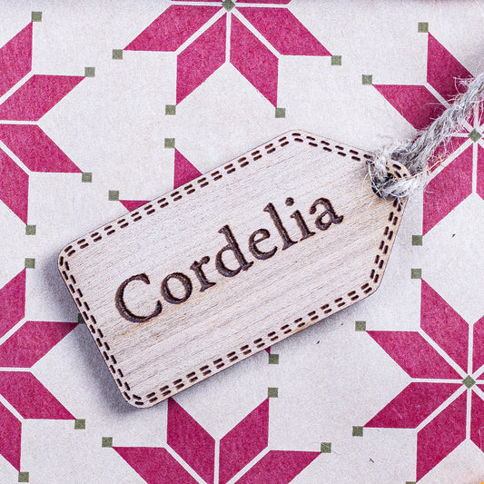 Personalised wooden Christmas gift tag with engraved name for festive wrapping