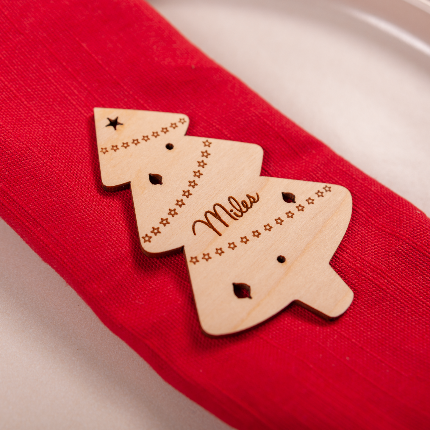 Custom engraved Christmas tree place card standing on dinner table