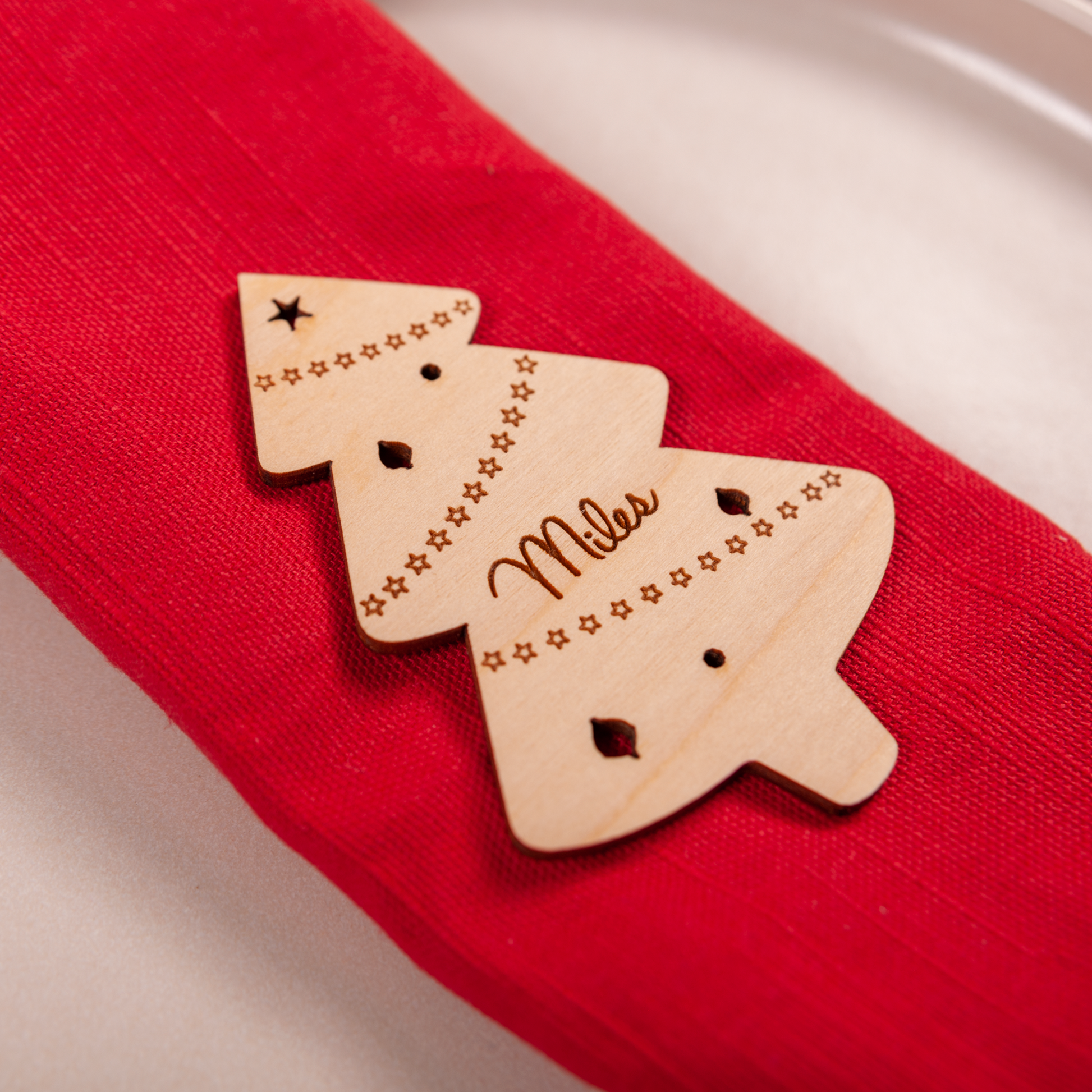Custom engraved Christmas tree place card standing on dinner table