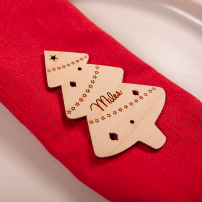 Custom engraved Christmas tree place card standing on dinner table