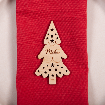 Family Christmas dinner table with personalised Christmas tree name cards