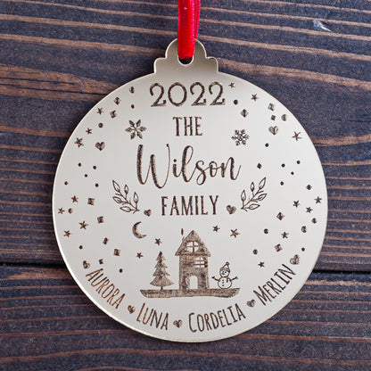 Engraved snowglobe-inspired family Christmas bauble in gold mirror