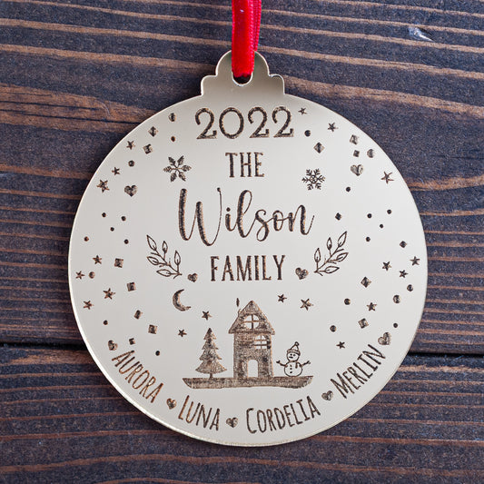 Engraved snowglobe-inspired family Christmas bauble in gold mirror