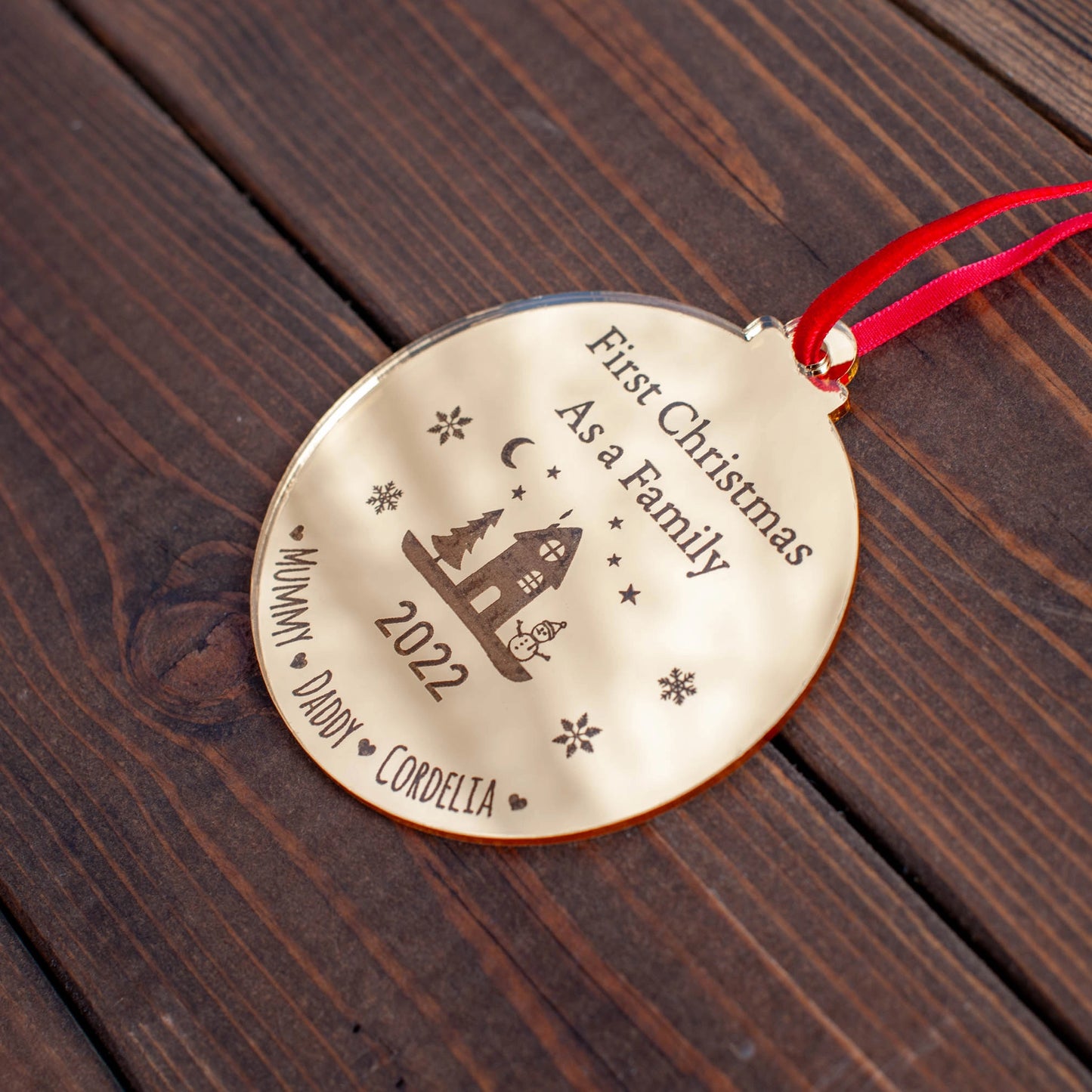 Engraved gold acrylic bauble with reflective finish