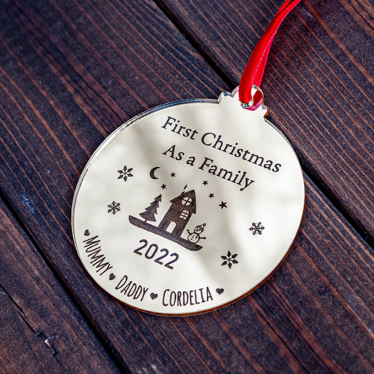 Gold mirror Christmas bauble engraved with family name and year