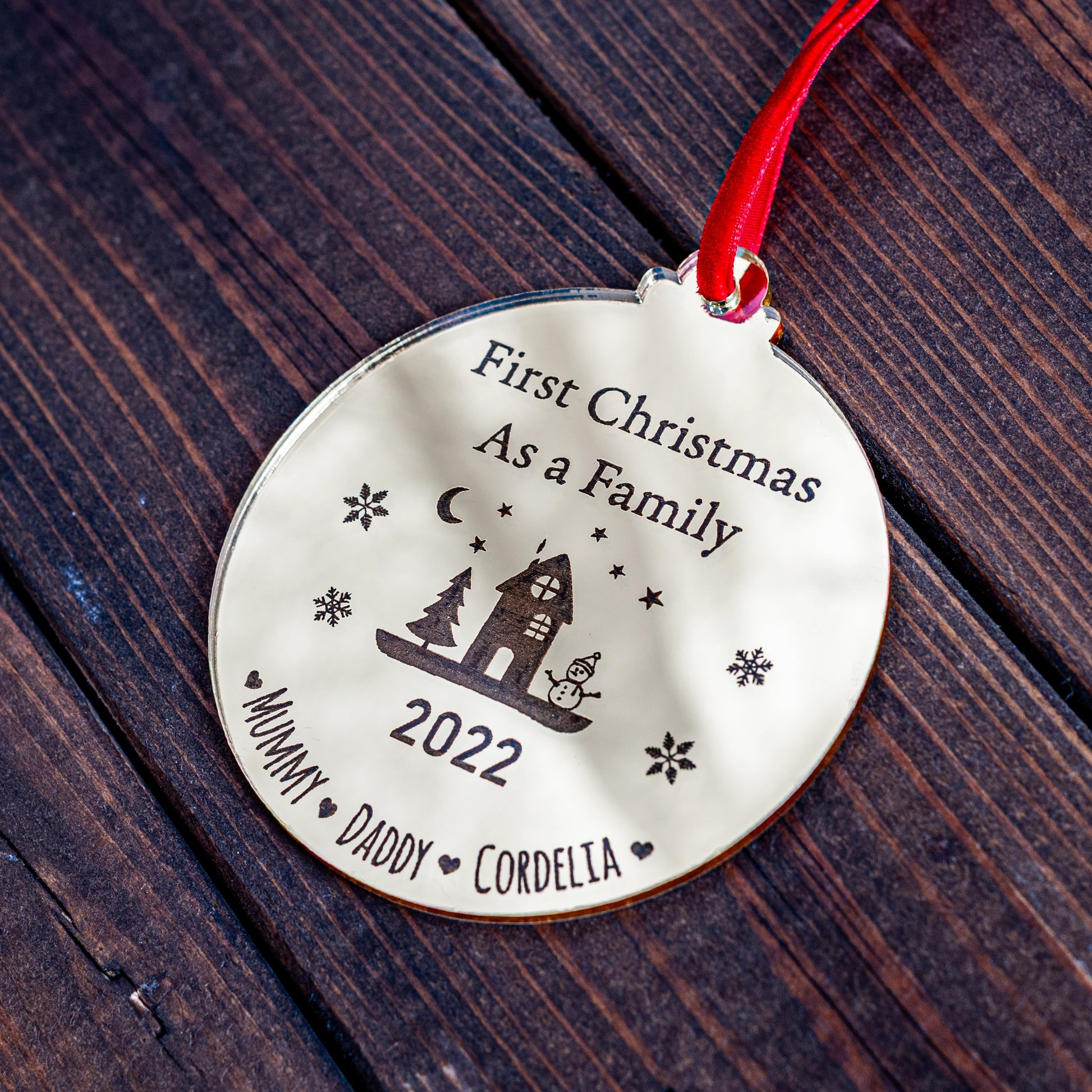 Gold mirror Christmas bauble engraved with family name and year