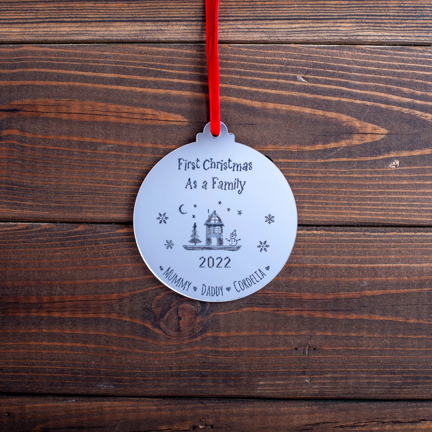 Custom family name bauble engraved for first Christmas together