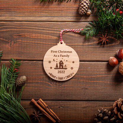Laser engraved wood bauble personalised for first family Christmas