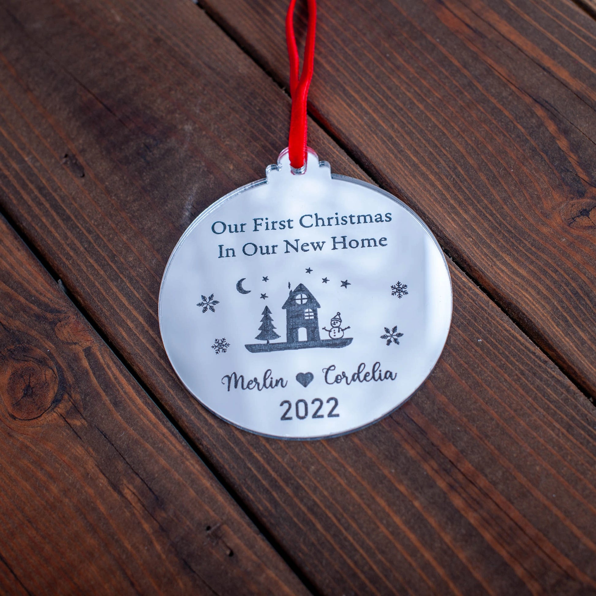 Elegant reflective silver Christmas bauble engraved with family name