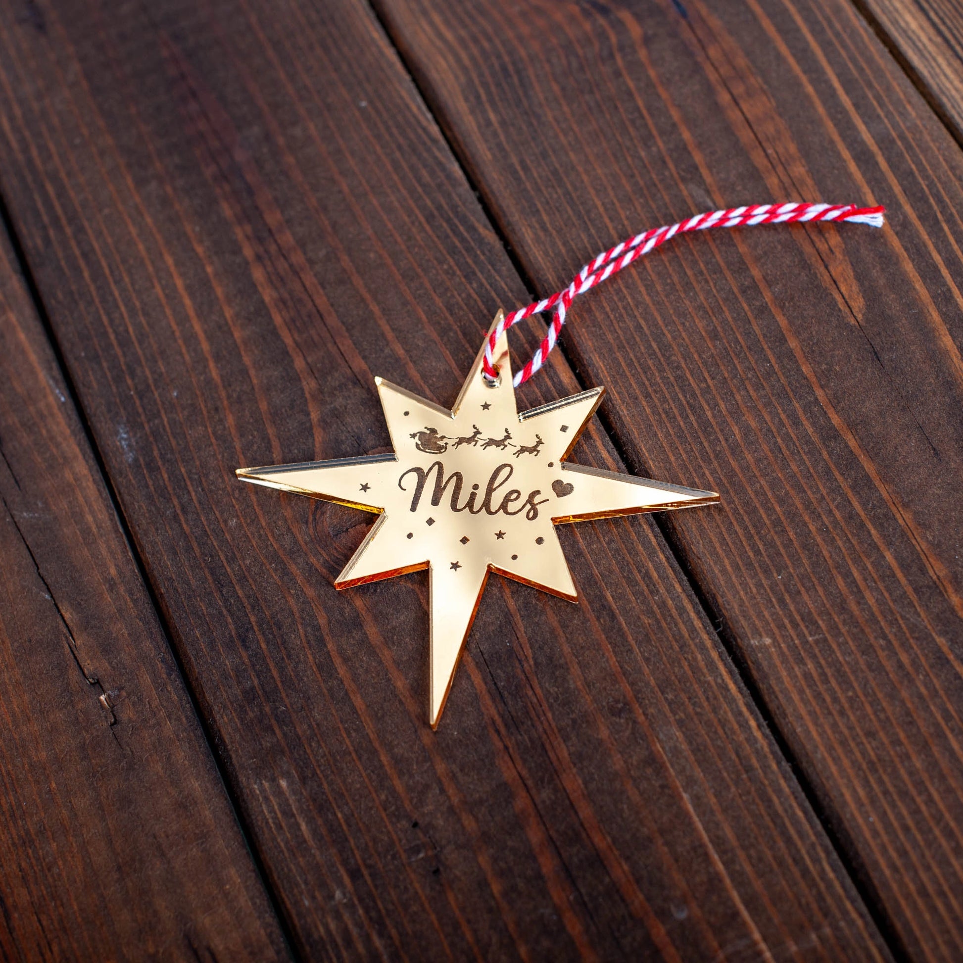 Rustic wooden Polaris bauble engraved with festive name