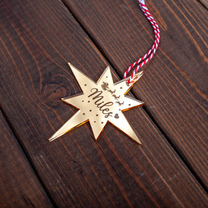 Personalised Christmas tree bauble featuring engraved Polaris star