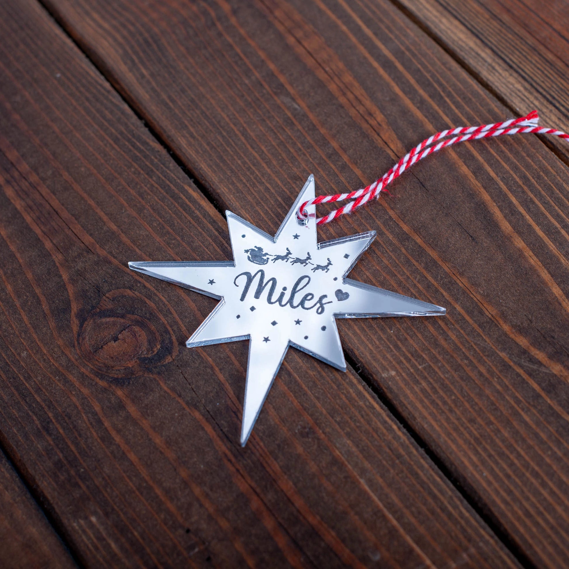 Laser-cut personalised Polaris Christmas decoration with ribbon