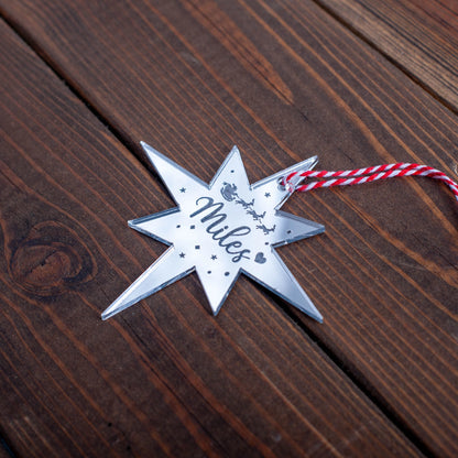 Silver mirror Christmas bauble engraved with name and celestial detail