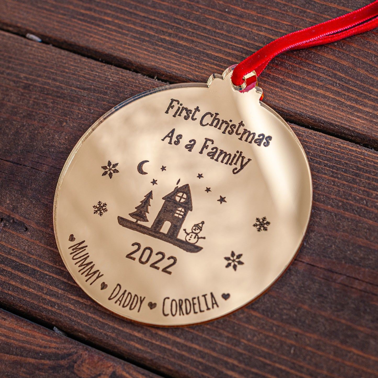 Gold mirror Christmas bauble engraved with family name and year