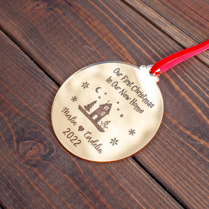 Personalised new house ornament hanging on festive tree