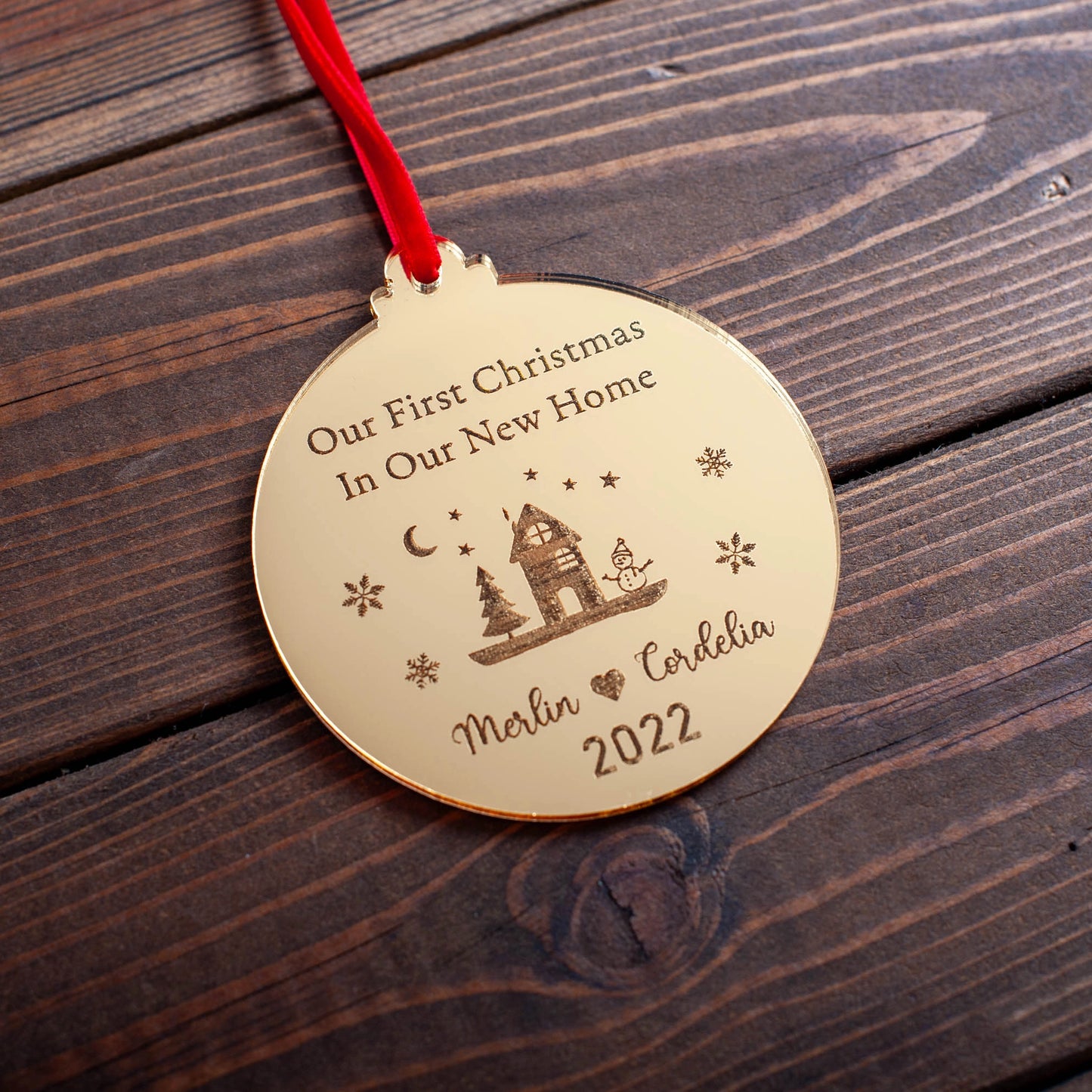 Gold mirror new home ornament reflecting Christmas lights