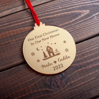 Gold mirror new home ornament reflecting Christmas lights