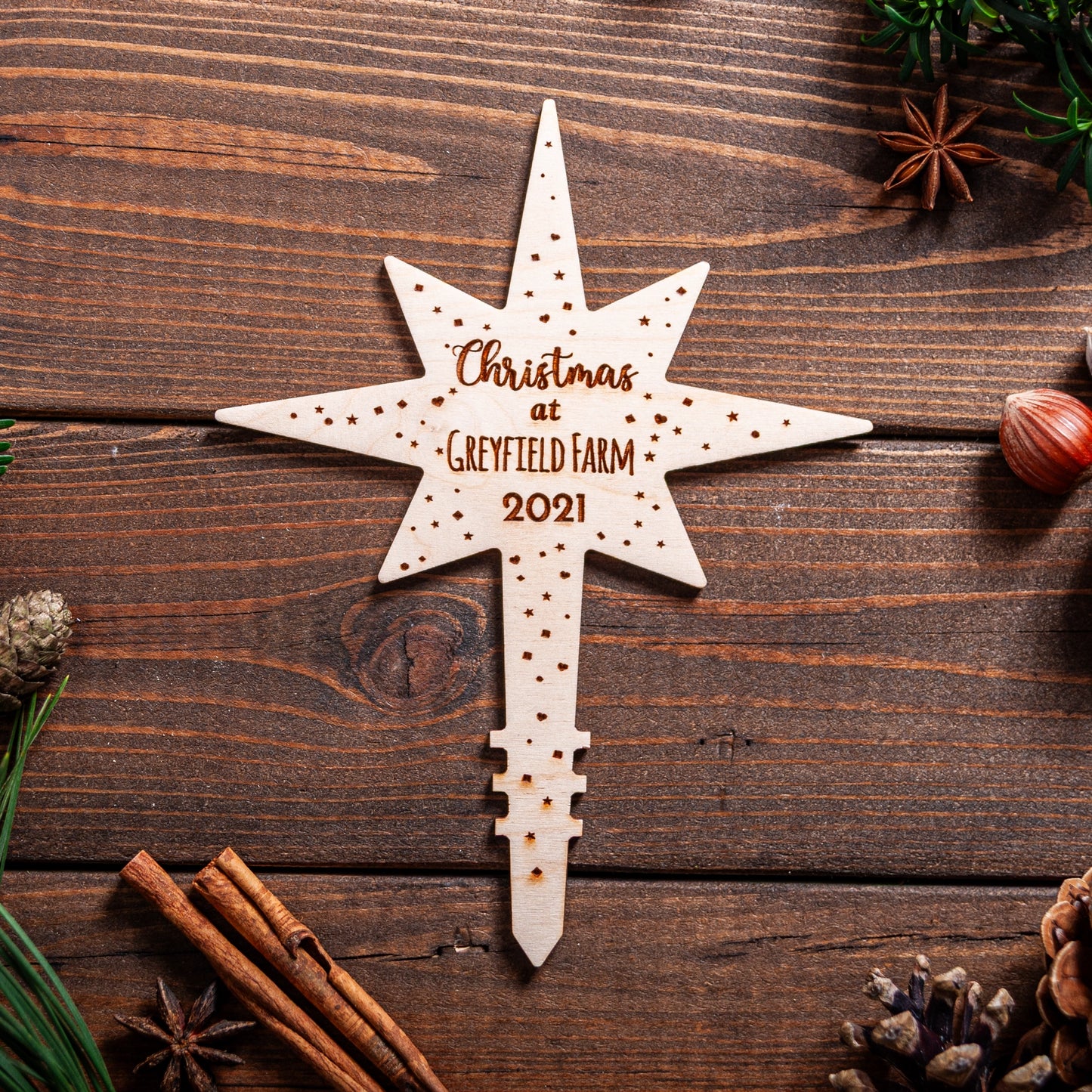 Wooden Polaris star tree topper engraved with Location name