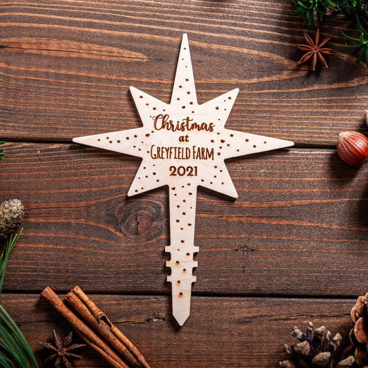 Wooden Polaris star tree topper engraved with Location name