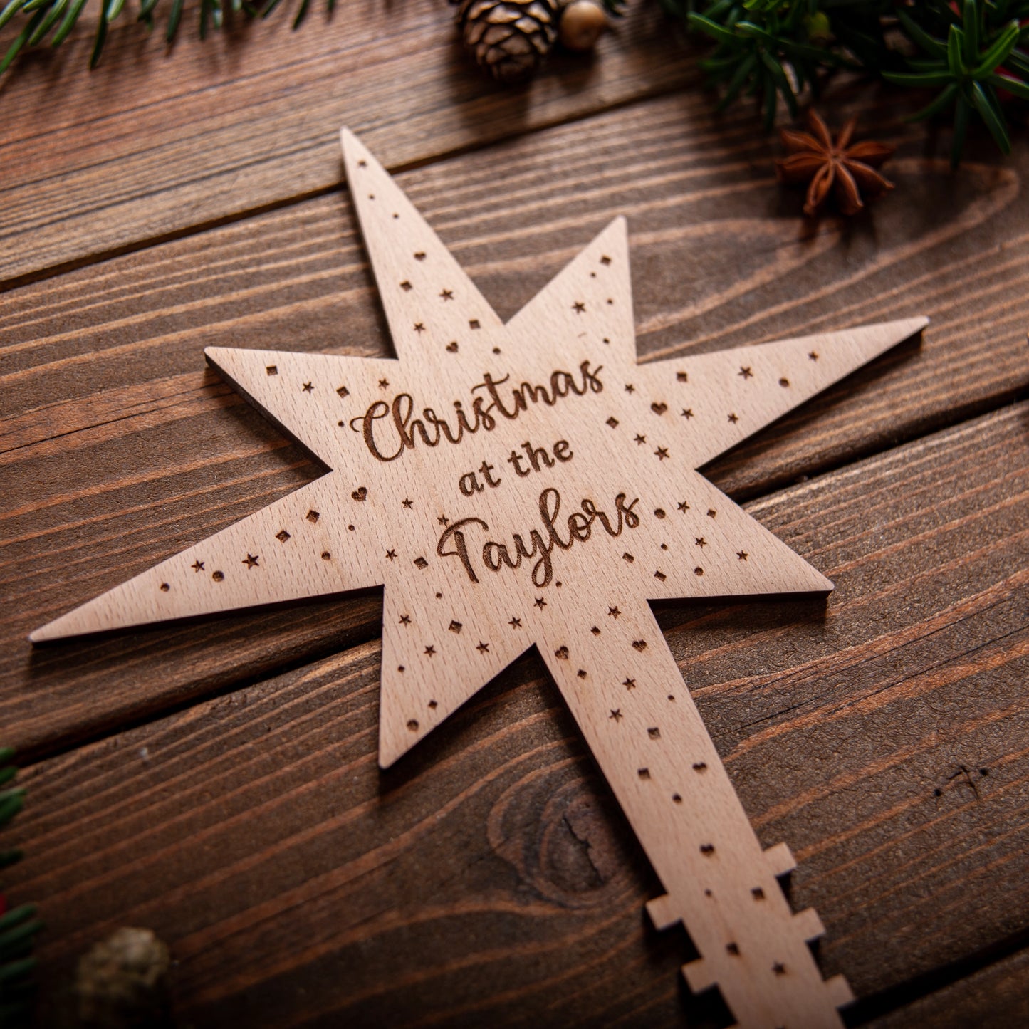 Premium Wooden Polaris star ornament reflecting tree lights
