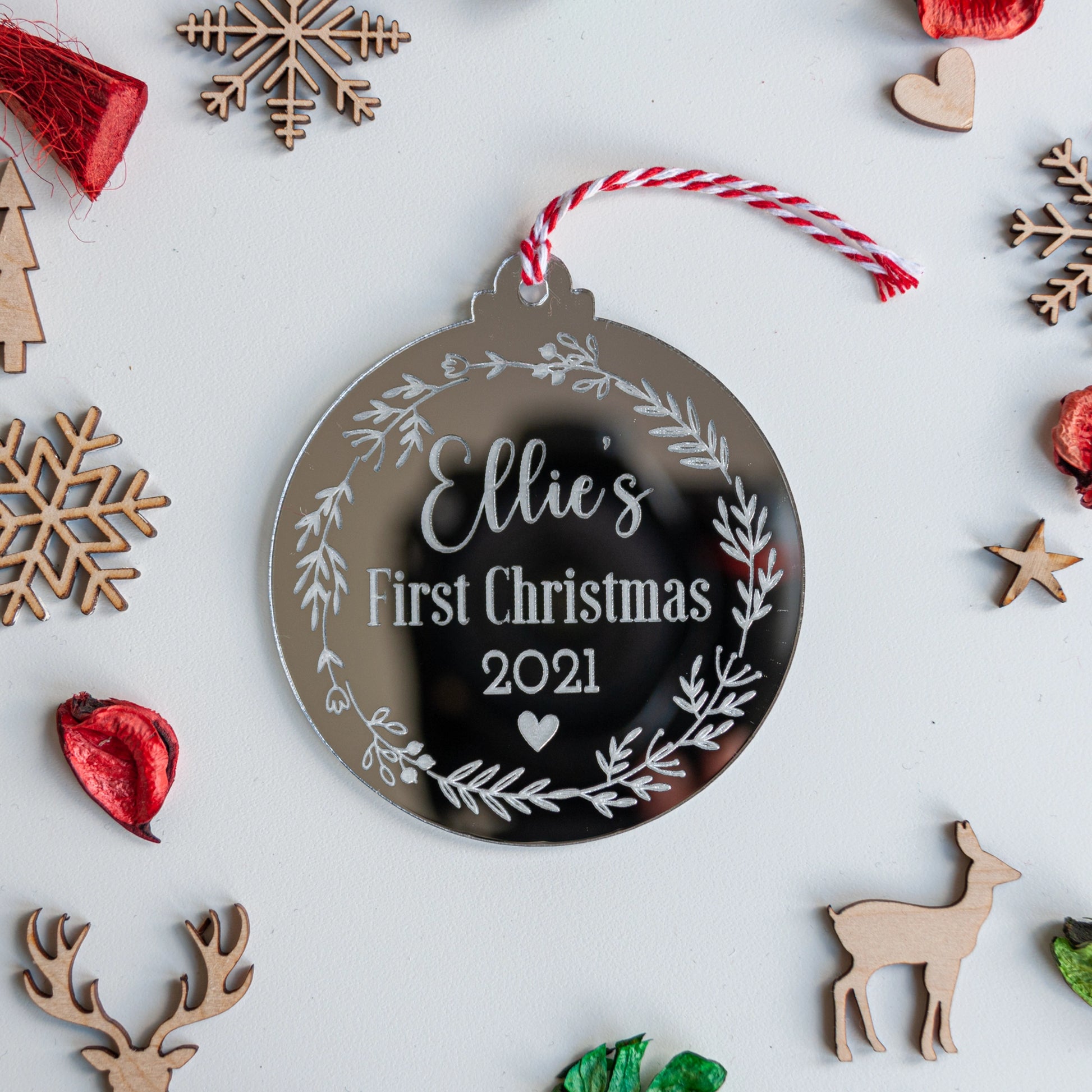Custom engraved baby name ornament for first Christmas decoration
