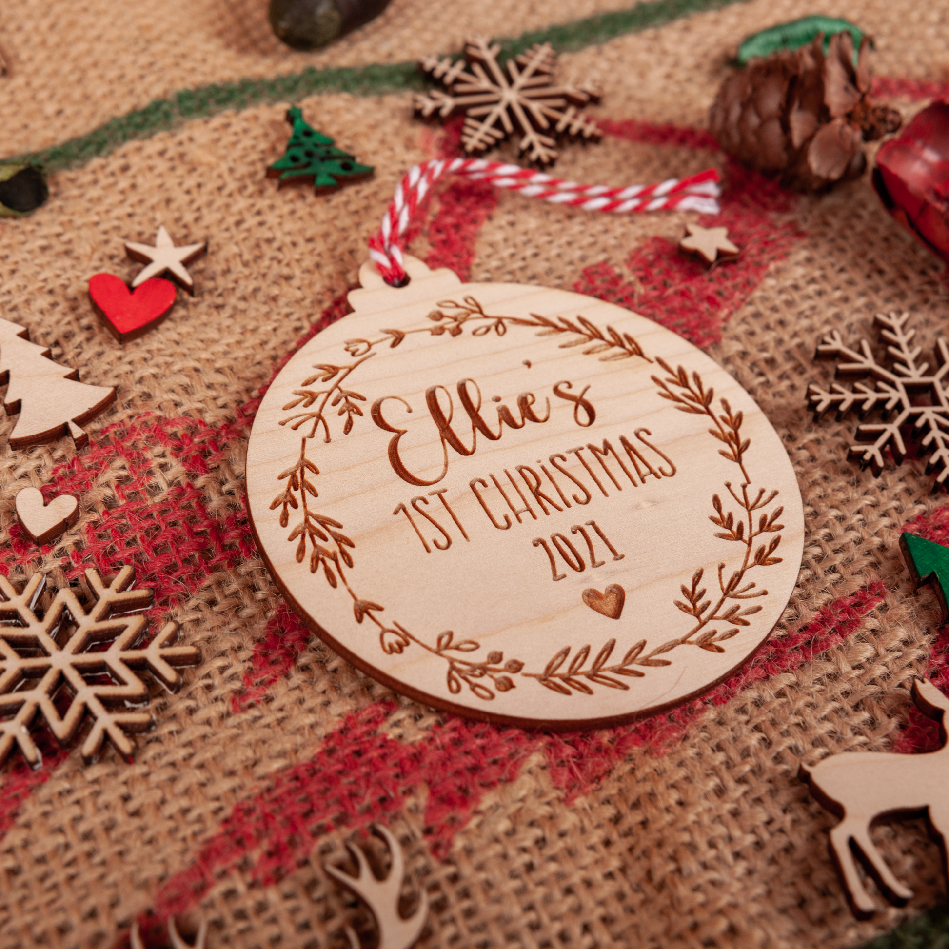 Rustic wooden bauble engraved with baby’s name and year