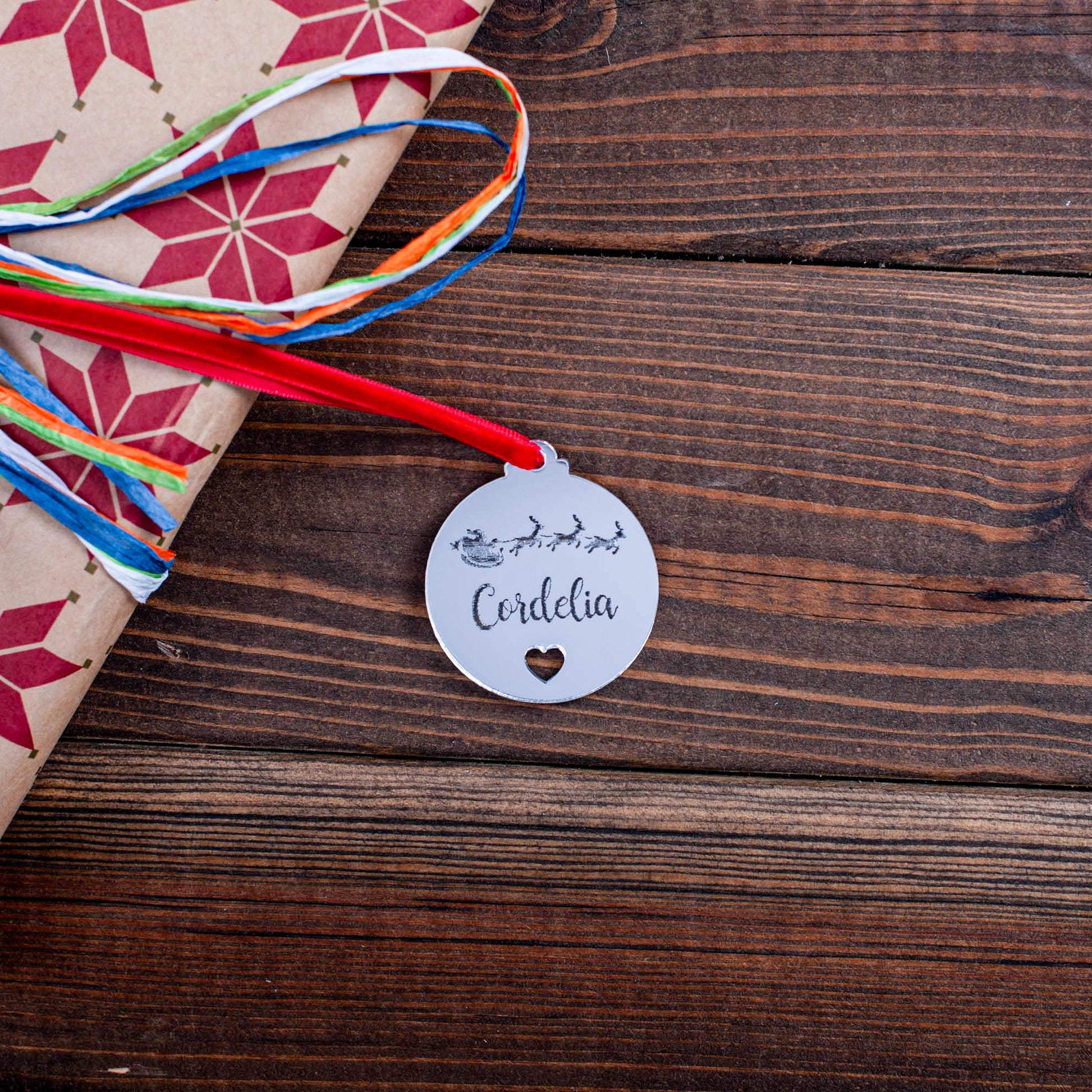 Personalised silver mirror bauble tag engraved with name and Santa detail