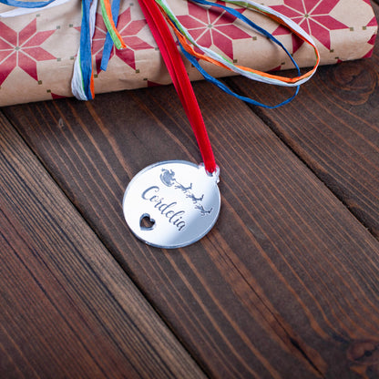 Luxury silver mirror acrylic Christmas gift tag reflecting festive lights