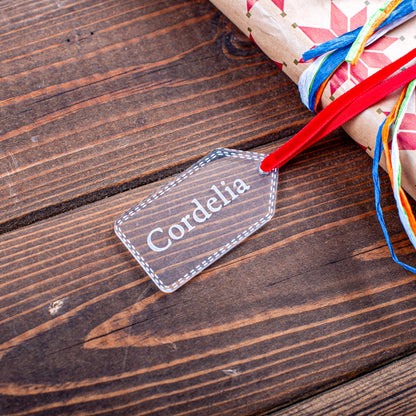 Modern clear acrylic stocking name tag for festive wrapping