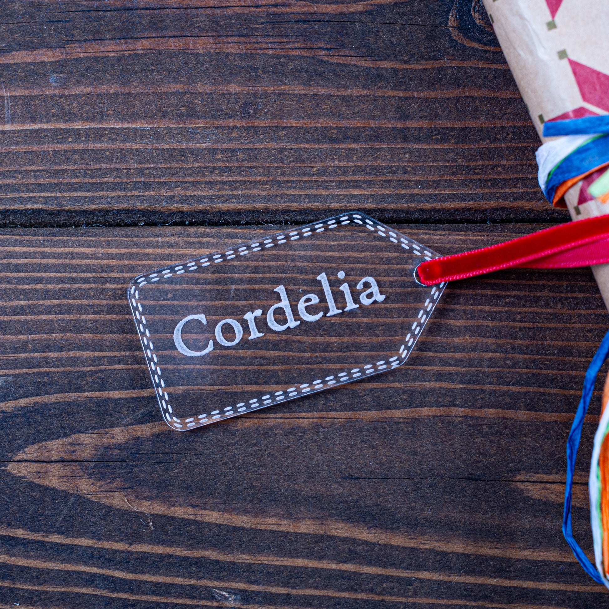 Personalised clear acrylic Christmas gift tag engraved with name