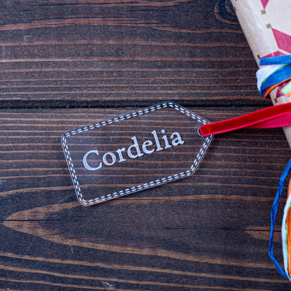 Personalised clear acrylic Christmas gift tag engraved with name