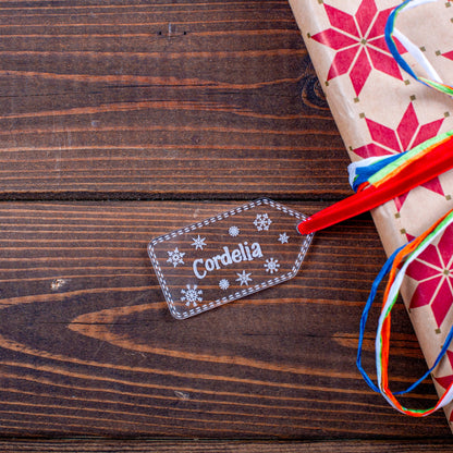 Personalised clear acrylic stocking name tag on wrapped present