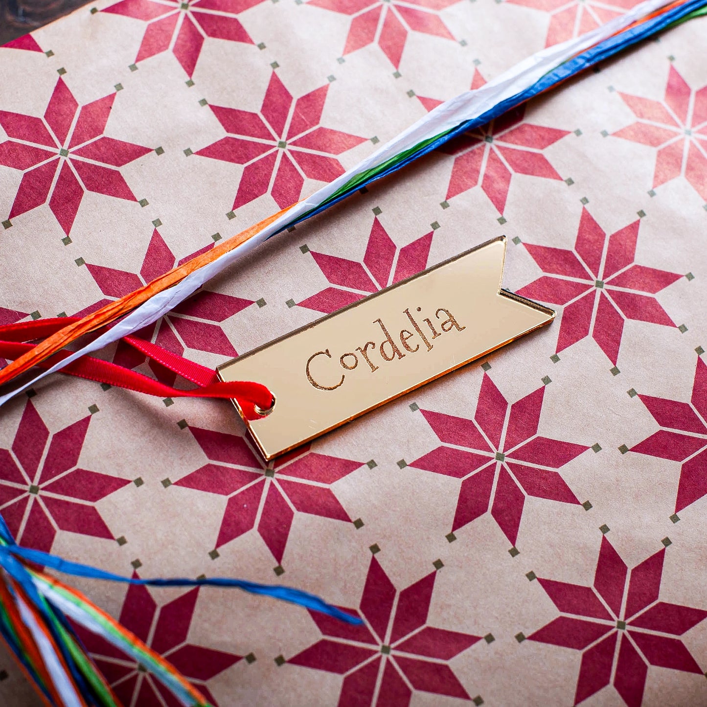 Luxury Christmas gift wrapping with personalised gold mirror label