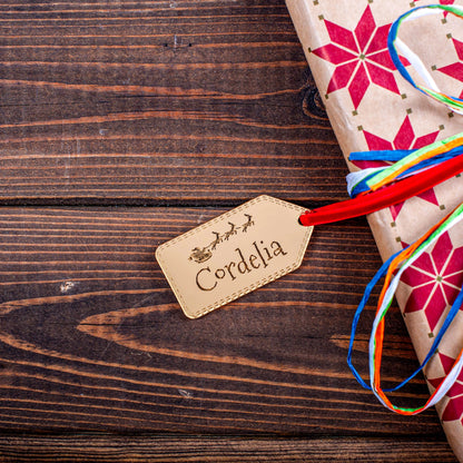 Luxury gold mirror acrylic Christmas tag reflecting fairy lights